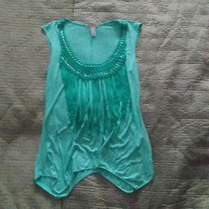 Turquoise sleeveless blouse with design